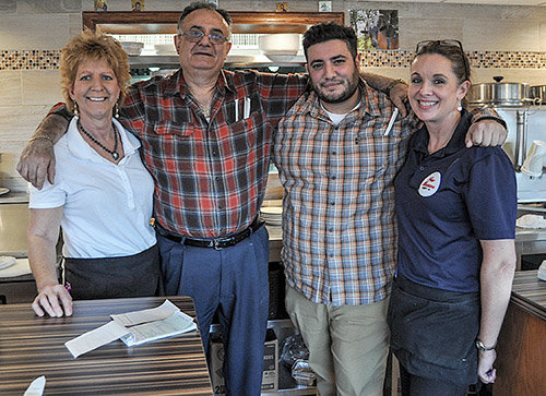 TRR photos by Jonathan Fox
&rdquo;Of course, our staff are members of the family, too,&rdquo; New Munson Diner proprietor Christos Kritikos, center, with son John, says of his employees