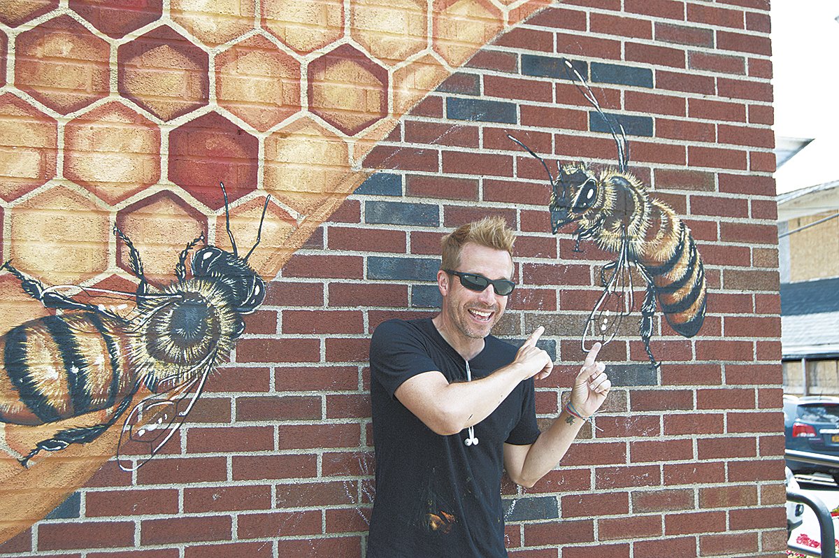 Willey with one of his completed bee friends on the post office wall.