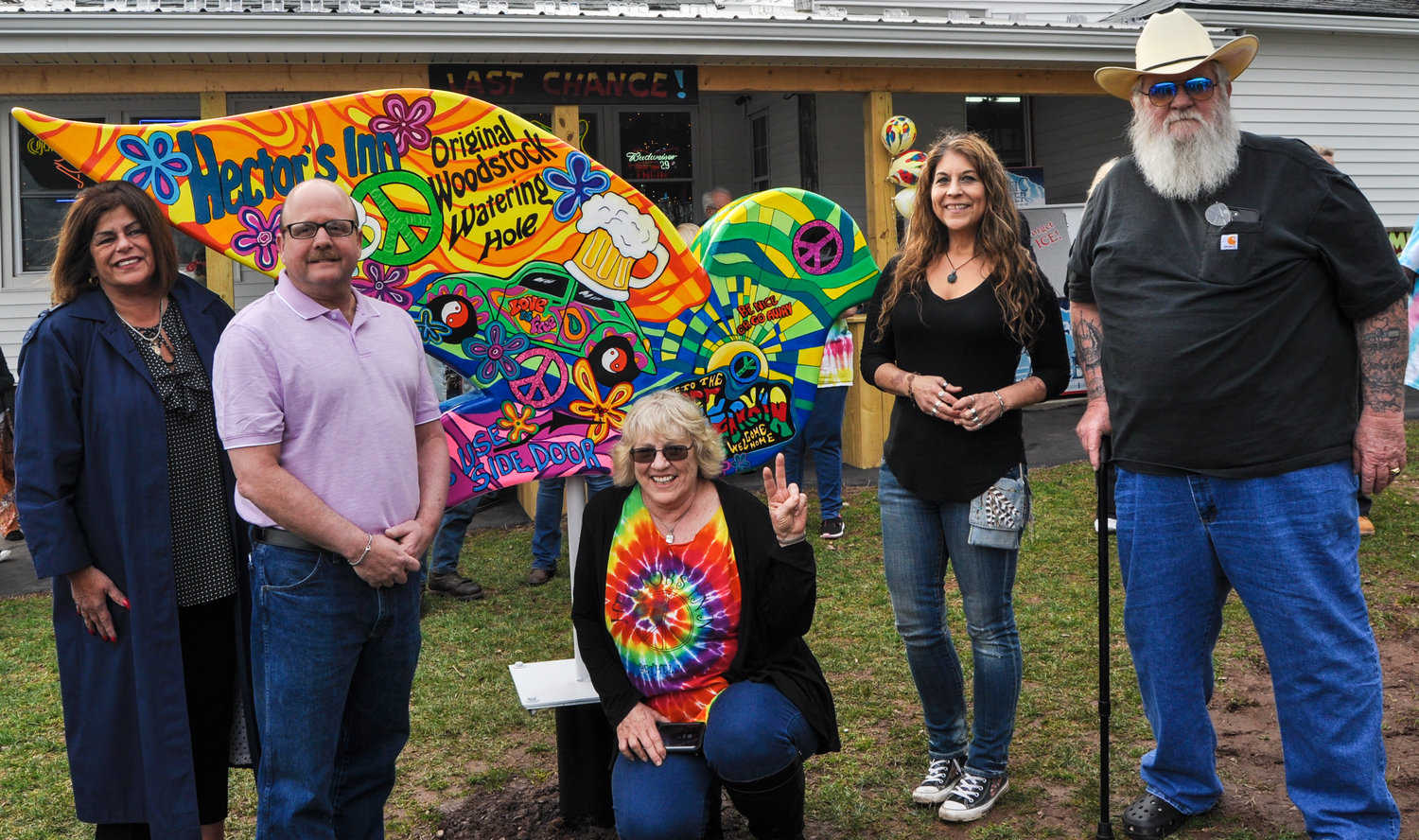 The 50th anniversary celebrations have come and gone, but the Sullivan Catskills Dove Trail is here to stay as a stunning tribute to the 1969 Woodstock Music Festival. Proprietor Bonnie Lagoda, center, flanked by SCVA President Roberta Byron Lockwood, left, and Town of Bethel Supervisor Dan Sturm joined dove artist Kim Simons and Woodstock icon Duke Devlin at the unveiling of the very first dove, located at Hectors Inn in Bethel, NY