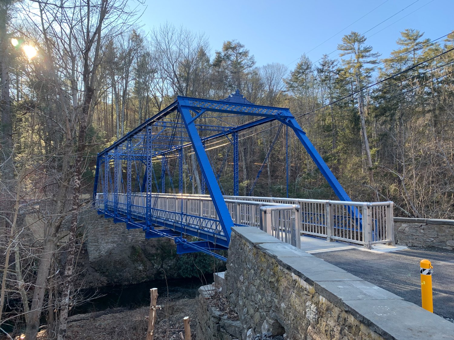 Beyond the rehabilitated blue bridge is a revitalizing footpath and a forested glen that is likely to send one’s sagging spirits down the Sawkill Creek flowing nearby.