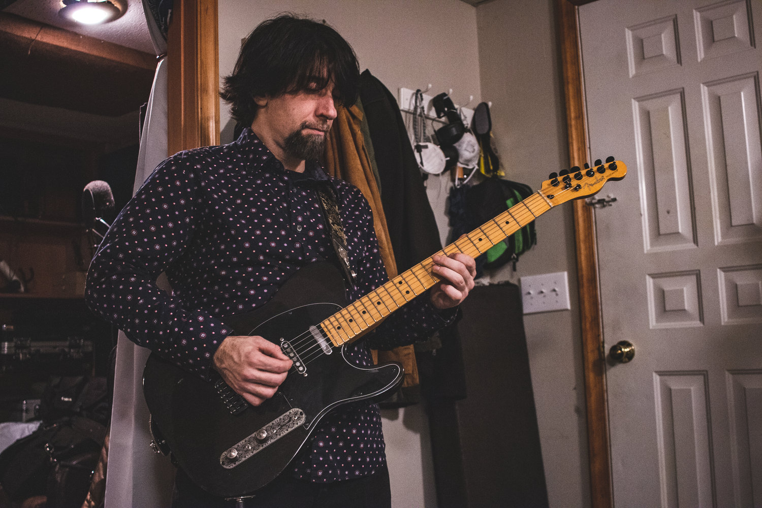 Jason Merrill records a guitar track in his home studio in Hawley, PA.