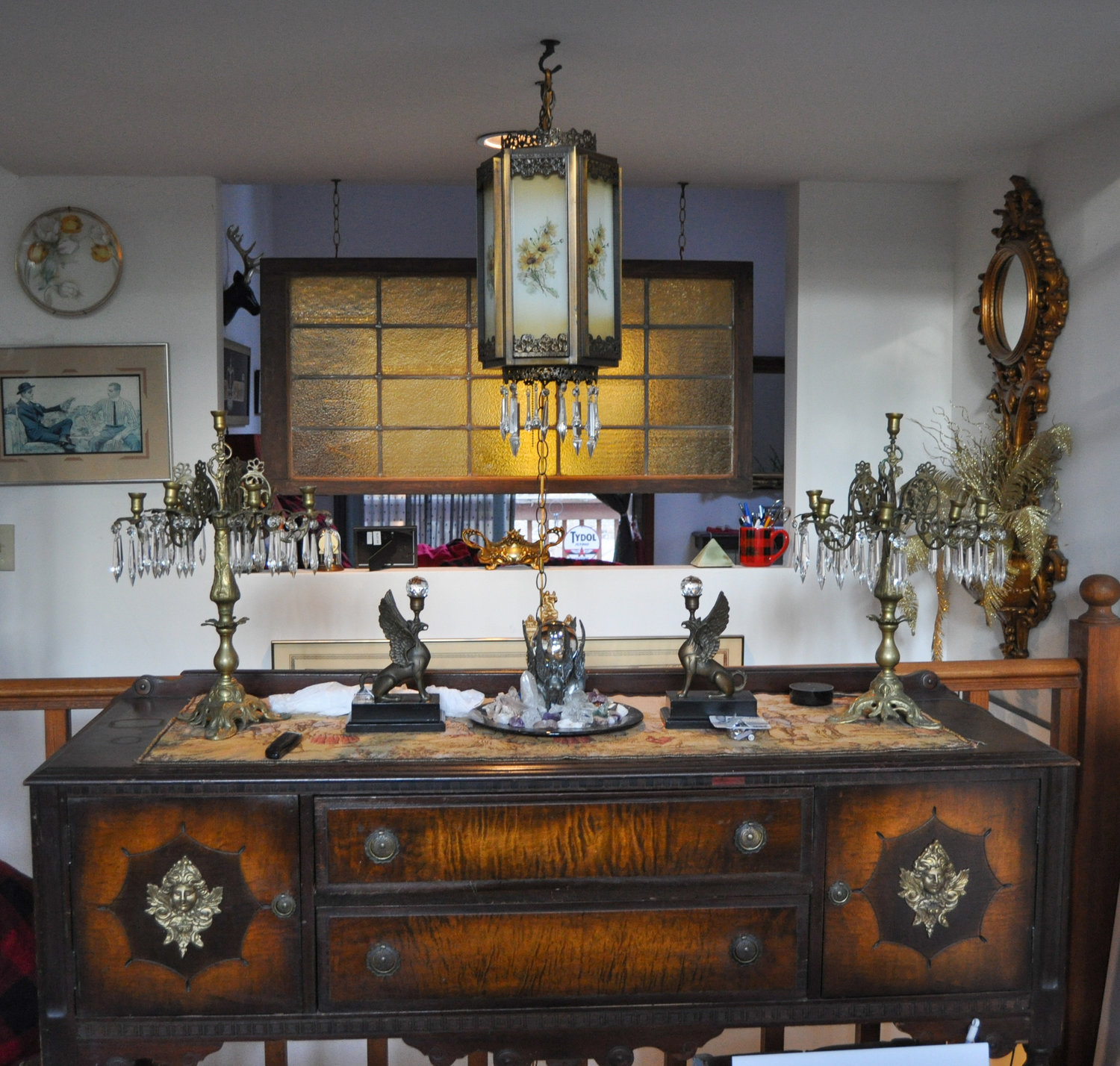 This antique sideboard serves as a beautiful surface for my Baroque candelabrum, a pair of handmade bronze griffins and my collection of crystals, gathered over many years from my travels around the globe. Be it ever so humble, this is my home sweet home.