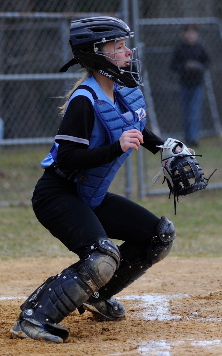 In the moment. Sullivan West’s catcher Jenna Kratz is poised to snag a peg to the plate.