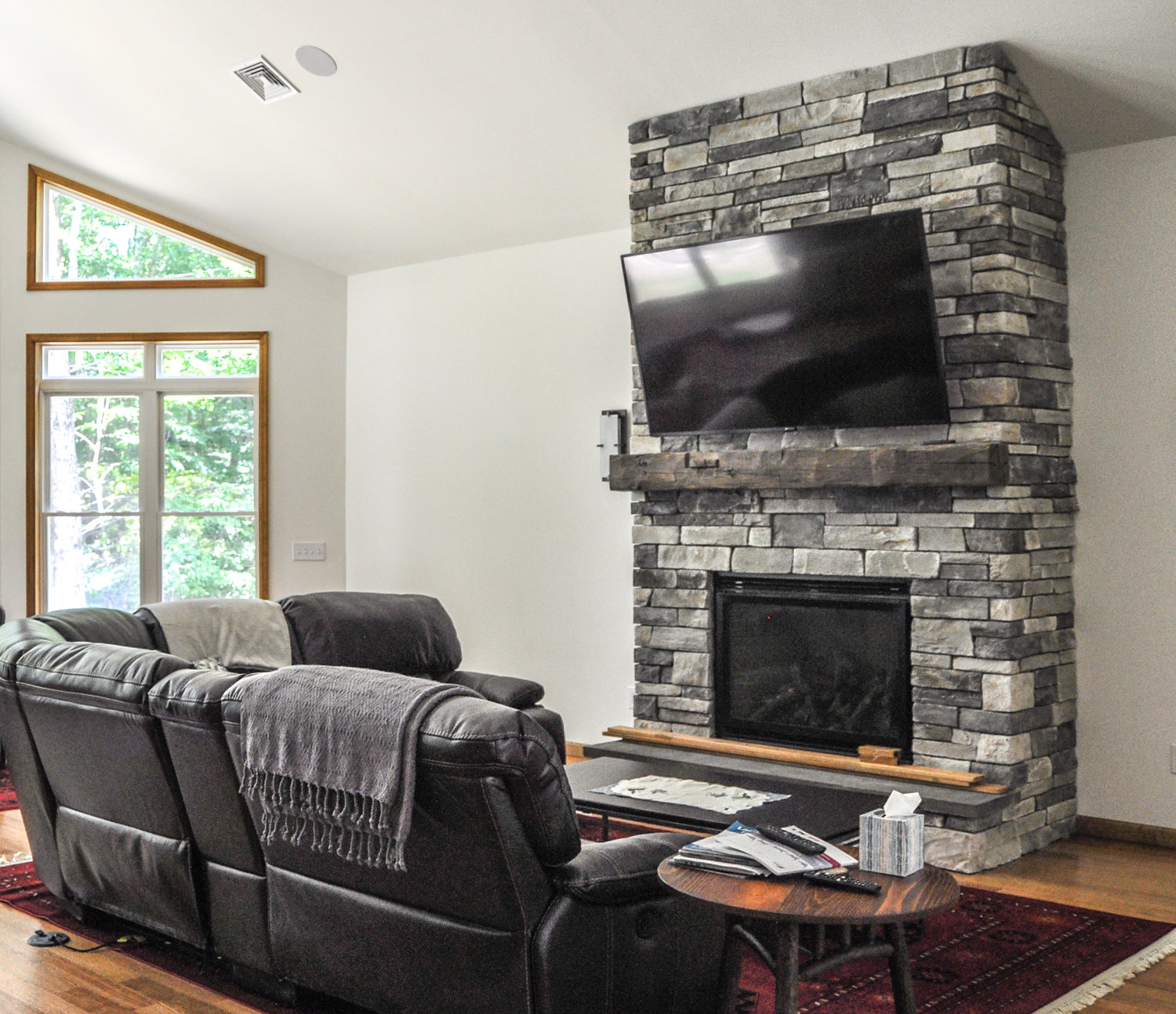 The fireplace draws the eye in the living room and promises warmth come winter.
