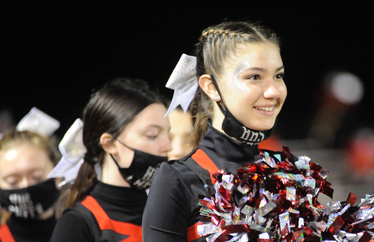 All a-glitter. Hornets football cheerleader, 15-year-old sophomore Rochelle Krast.