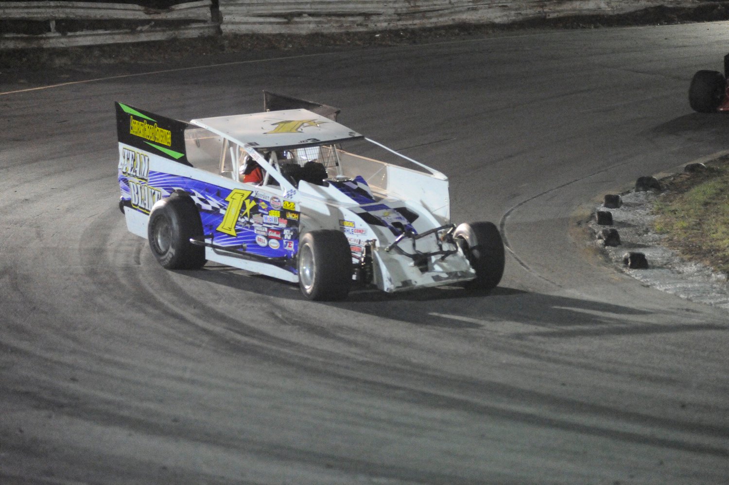 Headed for third. Jerry Curry carves a corner in the DIRT modified feature race.