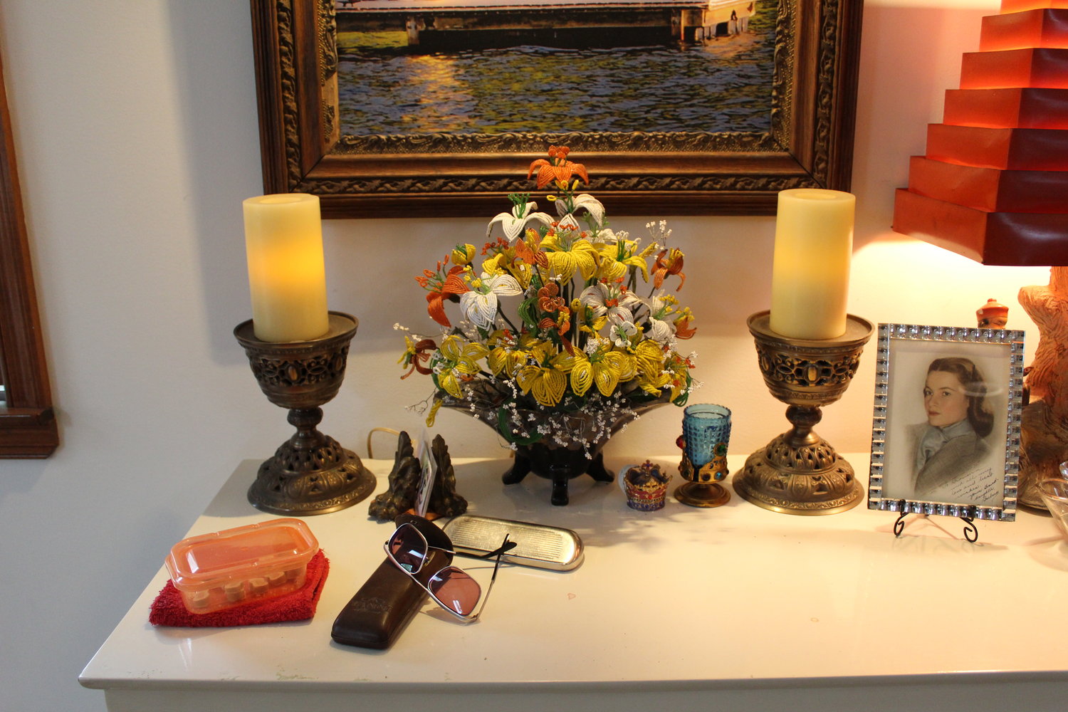 Still life with candles, glasses and a portrait of Barbara Fox at age 15.