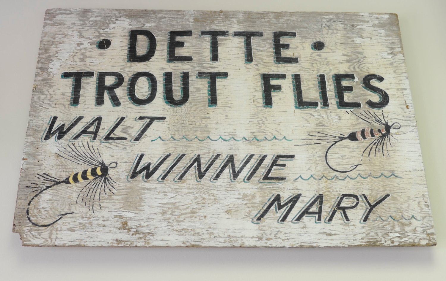 Sign of by-gone times. The original sign from Dette Trout Flies when it was run by Walt and Winne Dette, along with their daughter, Mary, who while not in the area, still ties flies.