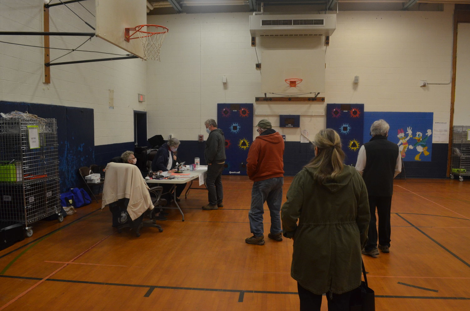 Voters line up at the Duggan Community Center in Bethel.