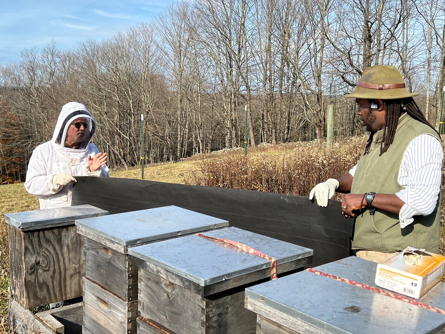Bees can survive cold and they can survive wet, but not both cold and wet. Here, Art Riegal and Tofowa Pyle eliminate the hazards.