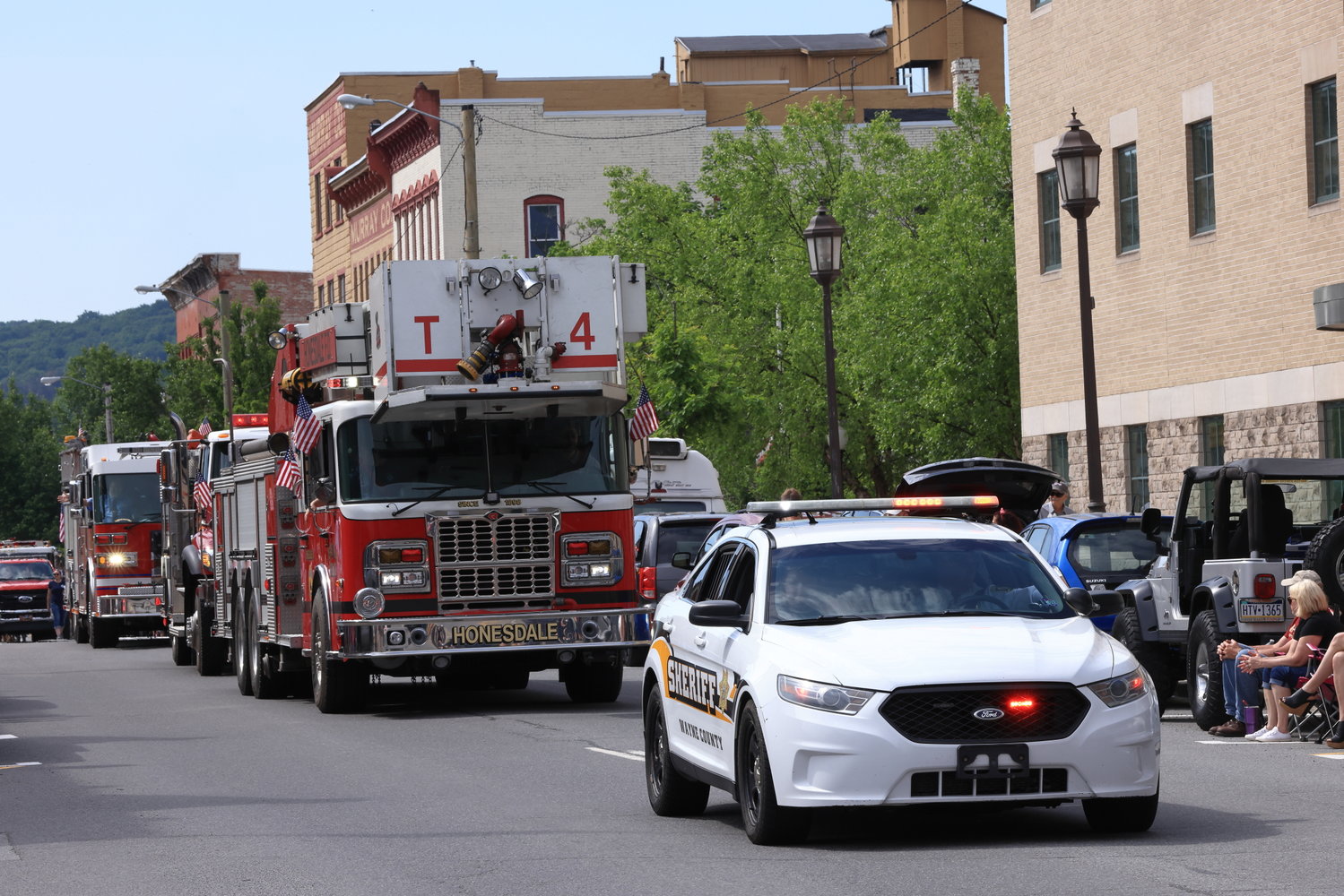 The Honesdale Police and Fire Department leads the 2022 Memorial Day Parade down Main Street.