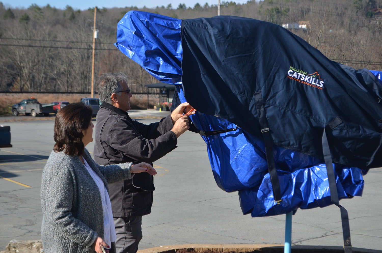 Eagle Valley Realty owner Dawn Curreri oversees the installation of Narrowsburg's new dove.
